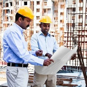engineer and architect on cconstruction site in India